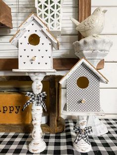 two bird houses sitting on top of a table next to each other with the caption looking for some spring ideas? how about these dollar tree house?