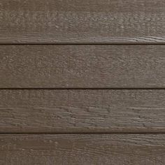 a close up view of the wood grains on a house's exterior wall