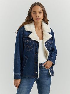 With cooler weather on the horizon, our Women’s Western Sherpa-Lined Denim Wrange Coat makes it easy to warm up your look without sacrificing style. It’s crafted from cotton and lined with sherpa to keep you cozy all season long. Plus, it comes with a slightly oversized fit that’s perfect for layering, two angled pockets for your essentials, two chest pockets with the “W” embroidery, and a notched collar delivering just the right amount of drama. Wrangler Sherpa Jacket, Jean Shirt Dress, Workwear Overalls, Cowboy Boots Square Toe, Ostrich Boots, Vest Coat, On The Horizon, Women's Jackets, Retro Women