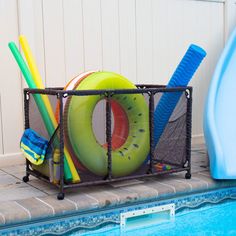 an inflatable pool float and swimming equipment are placed next to the pool