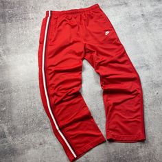 Add some vintage style to your workout with these red Nike sweatpants from the 00s. Made with comfortable cotton and an elastic waist, these pants are perfect for running, basketball, or hitting the gym. With a geometric pattern and classic Nike logo, these pants are a must-have for any sports lover. #VintageSportswear #NikeSweatpants #RedPants #Activewear #Throwback #MensFashion  #eBay #eBayStore #eBaySeller #Nike #Cotton #Activewear #Pants #Regular #Men #XL #Red #Basketball #Indonesia Red Nike Sweatpants, Vintage Nike Pants, Classic Nike, Pants Outfit Men, Vintage Sportswear, Sweatpants Outfit, Nike Sweatpants, Sports Lover, Red Nike