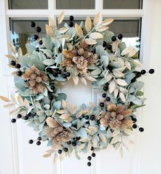 a wreath is hanging on the front door