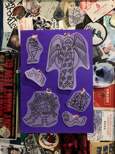 an assortment of stickers and magnets on a purple background with the image of an angel