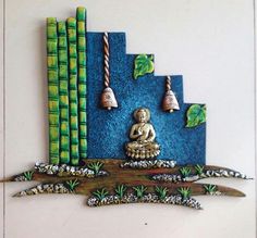 a buddha statue sitting on top of a tree branch in front of some bamboo stalks