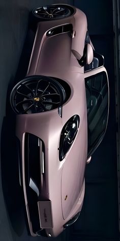 an overhead view of a pink sports car