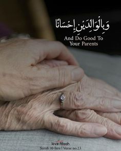 an elderly woman holding the hand of another person with arabic writing on it, which reads and do good to your parents