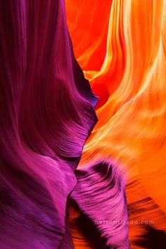 an image of the inside of a canyon that looks like it is painted in different colors