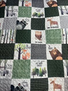 a quilt with animals on it and words written in different languages that read be strong, be brave