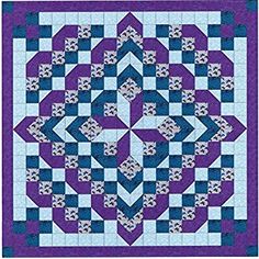 a blue and purple quilt with an intricate design on the center, in front of a white background