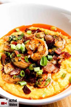 shrimp and grits in a white bowl on a wooden table with text overlay that reads southern shrimp and grits