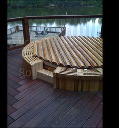 a wooden bench sitting on top of a wooden deck