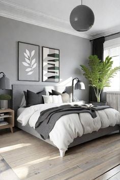 a bedroom with grey walls and white bedding