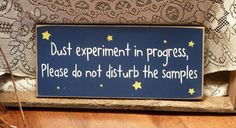 a sign that says dust experiment in progress, please do not disturb the samples