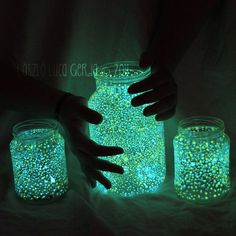 two jars with glow in the dark on them, one is filled with small stars