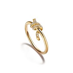 Tiffany Knot is an expression of love’s unwavering bonds. Inspired by an archival bow crafted in 1889, Knot is a symbol of life’s most enduring ties and meaningful connections. This ring is crafted with yellow gold and pavé diamonds, then polished by hand for high shine. Each round brilliant diamond—specifically chosen to meet Tiffany’s high standards—is hand set at precise angles to maximize brilliance. Wear this ring on its own or partnered with classic silhouettes for an unexpected pairing. 18k yellow gold with round brilliant diamonds; Carat total weight .05; Features Tiffany & Co. hallmark | Tiffany Knot Ring in Yellow Gold with Diamonds, Size: 9 Tiffany Diamond Ring Tiffany & Co., Tiffany Sixteen Stone Ring, Tiffany And Co Gold Ring, Tiffany And Co Jewelry Gold, Tiffany Ring Gold, Tiffany Engagement Ring Gold, Tiffany Knot Ring, Tiffany & Co, Tiffany Gold Ring