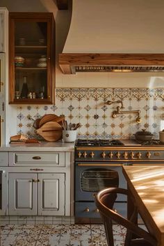 a kitchen with an oven, sink and table