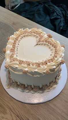 a heart shaped cake sitting on top of a white plate