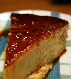 a piece of cheesecake on a plate with caramel sauce