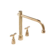 a brass faucet with two handles and nozzles