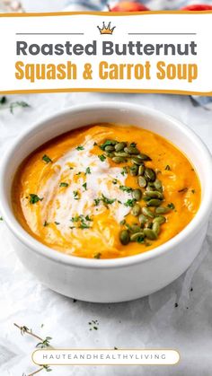 roasted butternut squash and carrot soup in a white bowl with green garnish