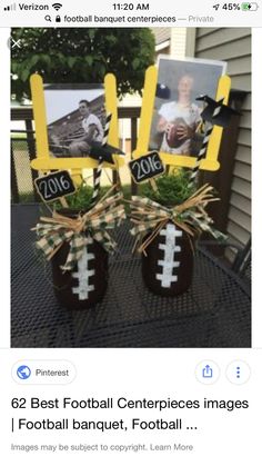 two football themed centerpieces on top of a table with pictures and grass in them