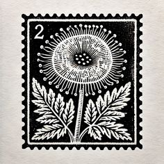 a stamp with an image of a dandelion in black and white on it