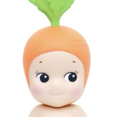 a small toy with a carrot on it's head