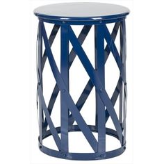 a blue and white side table with an open design on the top, in front of a white background