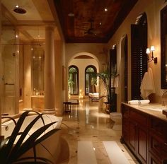 a large bathroom with two sinks and a bathtub in the middle of the room