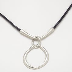 Ready-to-wear necklace is styled as a double loop, features a scratched surface finish and hangs from black imitation leather cord. The necklace is constructed of imitation rhodium-plated steel and "pewter" (zinc-based alloy). Leather, Wear Necklaces, Everyday Jewelry, Leather Cord, Lobster Claw, Gift Necklace, Rhodium Plated, Ready To Wear, Chain