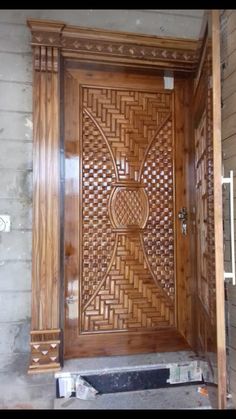 a wooden door with intricate carvings on it