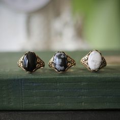 14 x 10mm cabochon on an antiqued sterling silver plated or brass adjustable ring. Easy to adjust to any size. Choose from Black Onyx, White Howlite, or Snowflake Obsidian. Black Obsidian Ring, Obsidian Ring, Cameo Jewelry, Cameo Ring, Snowflake Obsidian, Vintage Style Jewellery, White Howlite, Black Obsidian, Ring Black