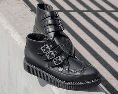 Keep your style sharp with these rocker ankle creeper boots that offers our same bold, iconic style in a vegan alternative option. Features an all-black upper made of our high quality TUKskin™ material — polishable synthetic faux leather that is both soft and breathable. Has a three-strap metal buckle closure with a low sole platform that measures approximately 1 ¼” at the heel and ¾” in the front. Includes removable gel insoles for added comfort. Shoe can be easily cleaned with mild soap and wa Black Creepers, Tuk Shoes, Creeper Boots, Pointed Boots, Comfort Shoe, Wing Shoes, Modern Shoes, Boot Straps, Most Comfortable Shoes