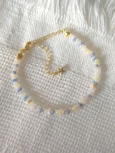 FOR OTHER DAINTY BEADED BRACELETS: https://www.etsy.com/ca/shop/ArtiChouXCanada?ref=seller-platform-mcnav§ion_id=46088511 Bracelet Length: 13-18cm (5.1-7 inches) with a 14k gold filled extender. This bracelet features an array of summer themed pastel colors: blue, white, cream, and light purple Japanese seed beads.  Thread may be visible since it is a handmade product   SIZING  Wrap a soft measuring tape snugly around the widest part of your wrist. Add 1.27cm (0.5in) to that measurement to determine the right bracelet size.  MATERIALS  - Japanese MGB glass seed beads(2x4mm) - 14K gold filled extender  CARE INSTRUCTIONS   To maintain its radiance, gently clean the bracelet with a soft cloth and store it in a jewelry box or pouch when not in use.   SHIPPING INFORMATION  Canada: Standard Ship Bead Bracelet Cute, Adjustable Pastel Beaded Bracelets, Beaded Bracelets Seed Beads, Small Glass Bead Bracelet Ideas, Matching Seed Bead Bracelets, Pastel Beaded Bracelets Gift, Pastel Beaded Bracelets As Gift, Pastel Beaded Bracelets For Gift, Adjustable Pastel Beaded Jewelry