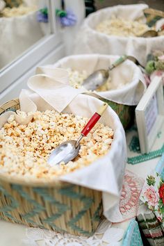 a spoon in a bowl filled with popcorn