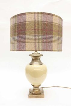 a lamp with a plaid shade on it