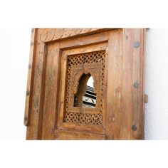 an old wooden door with a small window