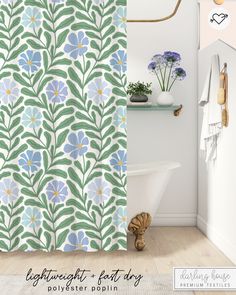 the bathroom is decorated with blue and green flowers