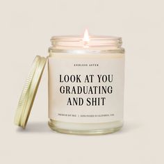 DescriptionThe Look At You Graduating and Sh*t Candle features: Reusable, apothecary-inspired glass jar with a brushed gold lid Off-white label with black text Natural soy wax, eco-friendly cotton wick, high-quality essential or fragrance oils Burn time up to 50 hours Hand-poured & designed in California in small batches Scent: Golden Hour Size8 oz: 2.75" x 3.50"About the BrandEndless Aster is your ultimate destination for candles that don't just hit the mark; they totally smash it. Started by a Kids Accessories Jewelry, Face Lotion, Candles Crafts, Main Event, Valentines Day Weddings, Digital Gift Card, Fragrance Oils, Cleanser And Toner, White Label