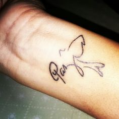 a person's arm with a tattoo on it that says love and an arrow