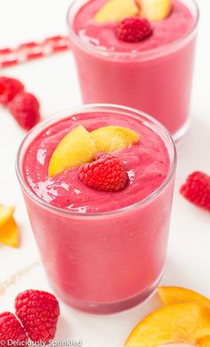 a smoothie is garnished with fresh fruit