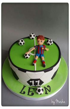 a birthday cake with a soccer player on it