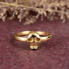 Small Skull Gold Ring, Handmade Halloween Ring, Gold plated Skull Ring, Horror Gold Ring, Finger Skull Gold Ring, Daily Wear Skull Ring,  Dimension :- JEWELRY CATEGORY:- HANDMADE RING PLATING:- 14k Gold  METAL: - Brass And 925 Silver RING SIZE:- ALL SIZES AVAILABLE PURTY:- 925 Shipping:- All the parcels will be shipped with in 1-2 days of purchase... Payment:- We accept payment through PAYPAL only.... I make every effort to picture each item as realistic as I can but colors can be slightly diffe Adjustable Skull Print Ring For Halloween, Symbolic Skull Rings For Halloween, Halloween Skull Rings Symbolic Style, Handmade Gothic Gold Ring, Skull Shaped Ring As Halloween Gift, Halloween Skull Print Ring As A Gift, Halloween Skull Ring Gift, Adjustable Skull Print Rings For Gift, Gothic Gold Rings For Halloween