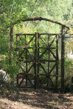 an old wooden gate in the woods