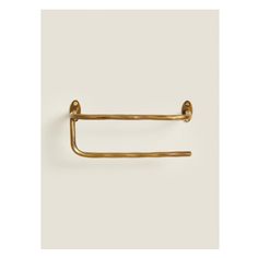 an antique brass towel ring on a white background