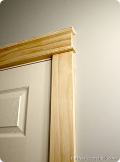 a white door with a wooden frame on it