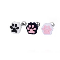 three different colored dog paw charms