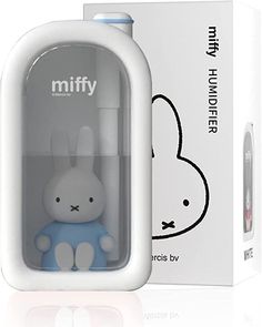 a white and blue miffy the rabbit toy in a box next to it's packaging