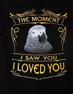 a black t - shirt with an image of a parrot on it's chest that says, the moment i saw you loved you