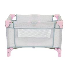 a pink and white baby crib with polka dots